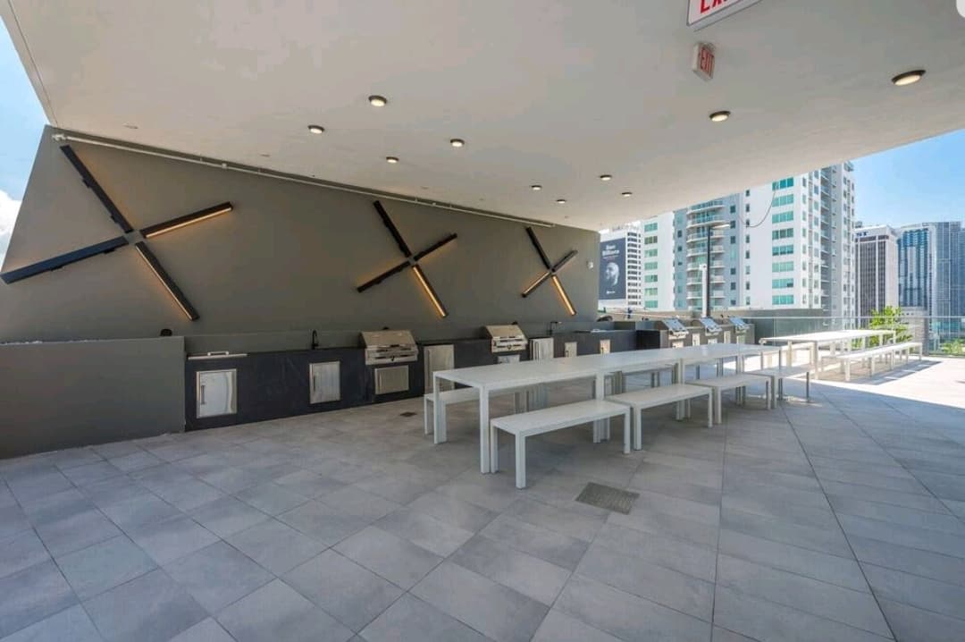 Rooftop BBQ terrace with grills and seating overlooking Tysons