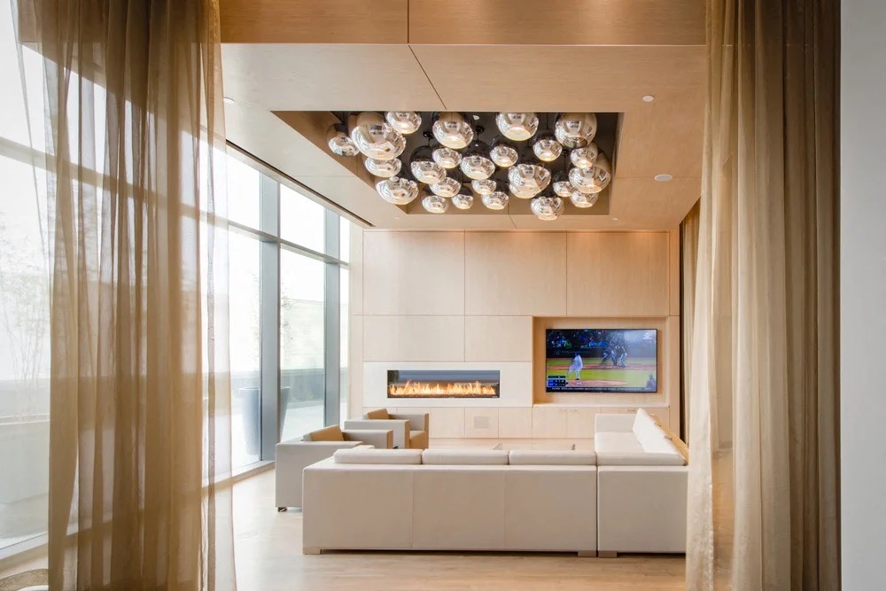 Elegant lounge moment with sculptural seating and warm lighting